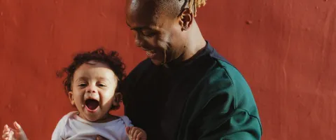 Man holding happy child