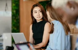 2 women looking at each other, irritated